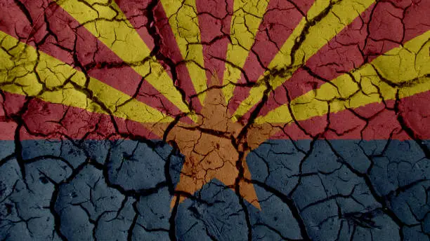 Political Crisis Or Environmental Concept: Mud Cracks With Arizona Flag