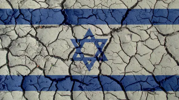Political Crisis Or Environmental Concept: Mud Cracks With Israel Flag