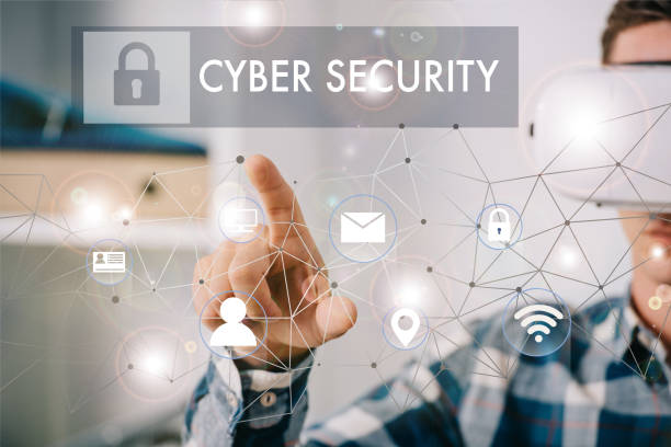 istock man in virtual reality headset pointing at cyber security signs in room 1070773558