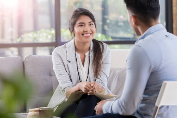 istock Attentive counselor talks with patient 1070775108