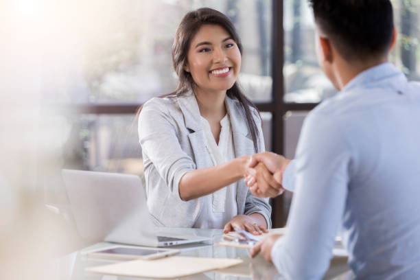 istock Businesswoman shakes hands with client 1070775132