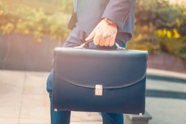 istock Business person holding a briefcase 1070777074