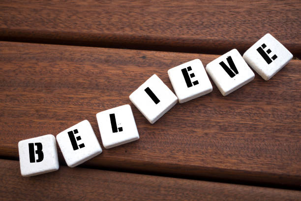 istock BELIEVE Concept  with alphabet blocks on wooden table. 1070777722