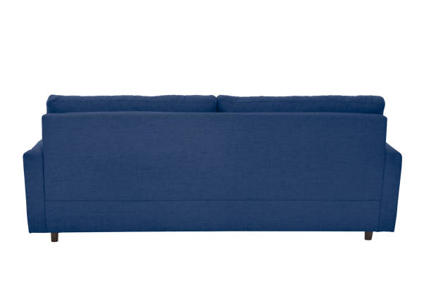 Three seats cozy beige fabric sofa isolated on white background stock photo