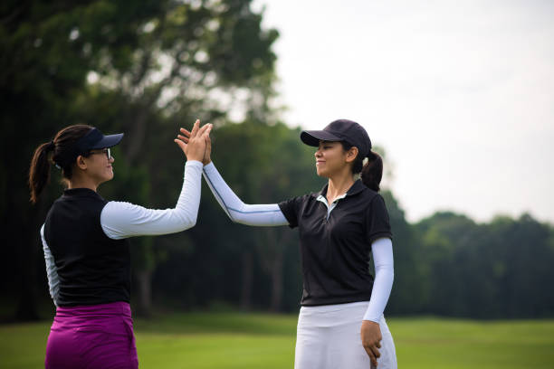 istock Golfers celebrating the game with a high five 1070780302