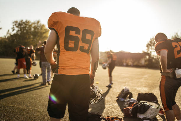 istock Football players on a field 1070780514