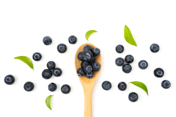 istock blueberries on spoon isolated on white background 1070782490