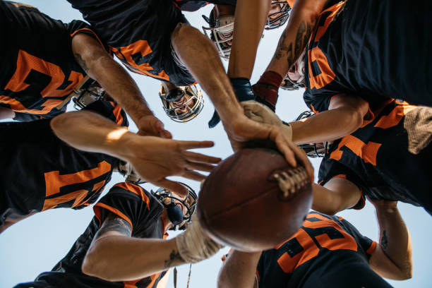 istock Football Players Huddling 1070782504