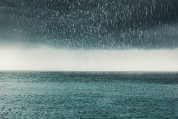 istock dramatic clouds and rain over the sea 1070786650