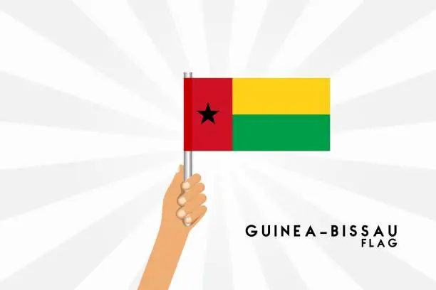 Vector illustration of Vector cartoon illustration of human hands hold Guinea Bissau flag. Isolated object on white background.