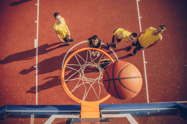 istock Male players playing basketball 1070793480