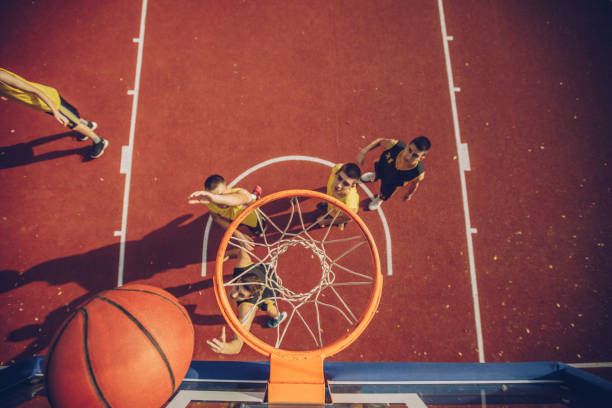 istock Group of players playing basketball 1070793906