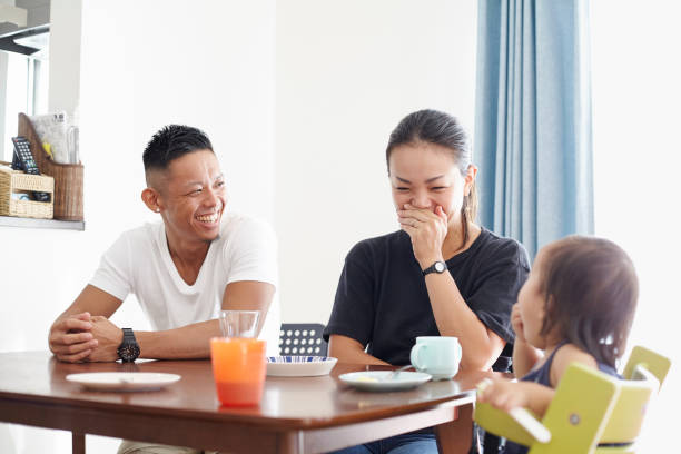 istock A family laughing at the table. 1070806932