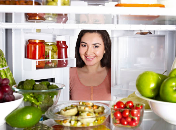 istock Woman looking into a fridge 1070810122