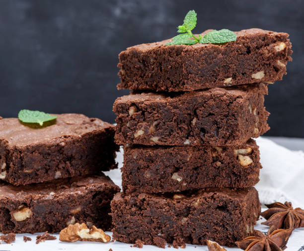 istock stack of baked square pieces of brownie pie 1070817314