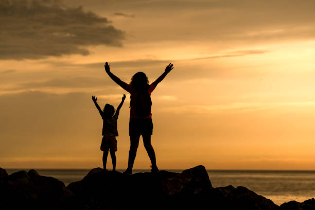 istock Mother and daughter at sunset 1070819308
