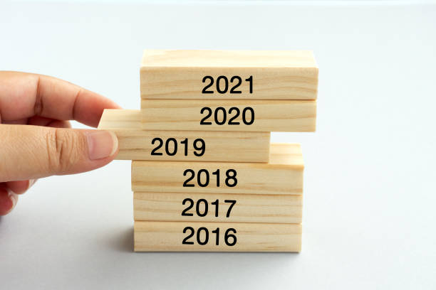 istock Hands Picking Wood Block With The Number 2019 1070823474