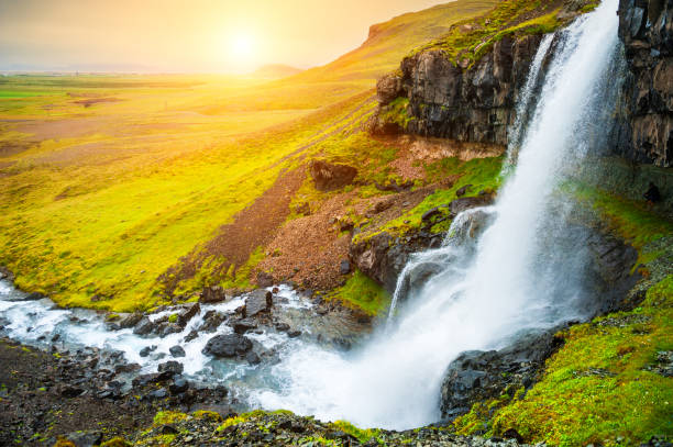 istock Beautiful waterfall in Iceland at sunset. 1070832684