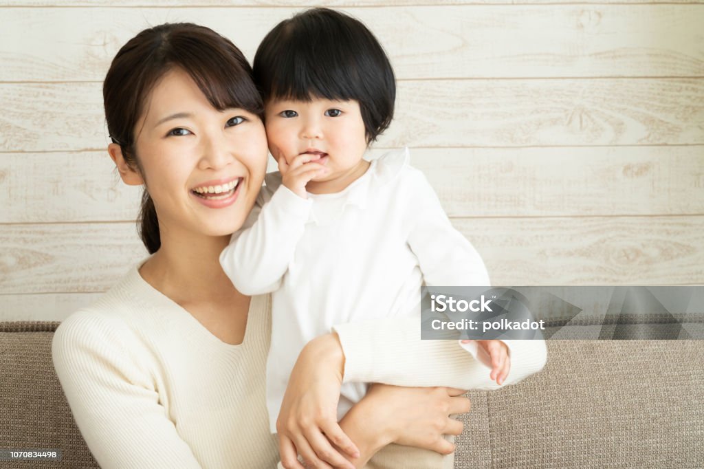 asian mother and baby in the living room Mother Stock Photo