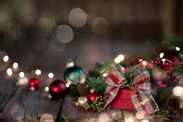 istock Christmas garland wreath with gift on old wood background 1070836682