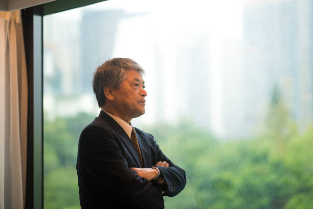 istock Senior Asian businessman getting ready in his hotel 1070836938