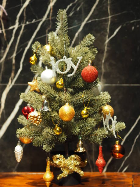 istock Christ's Mass tree Christmas Trimmings Decoration Gift box Colored balls Snow Globe bell Nutcracker Lights 1070837420