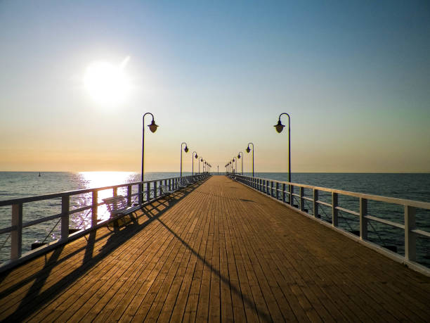 istock Sunrise over pier in Gdynia, Poland. 1070842802