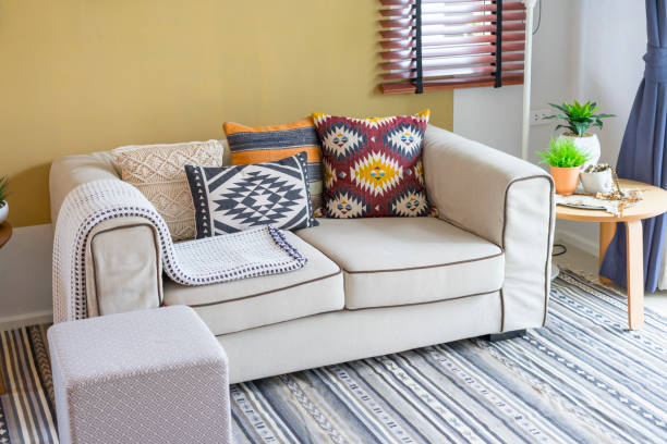 istock Native american pattern pillow on beige sofa in living room. 1070844672