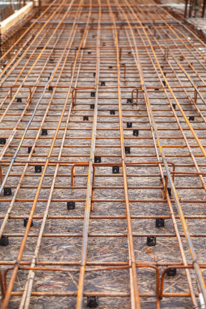 istock Construction of a new building, binding of reinforcement 1070845750