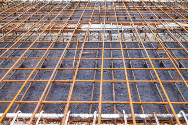 istock Construction of a new building, binding of reinforcement 1070845782
