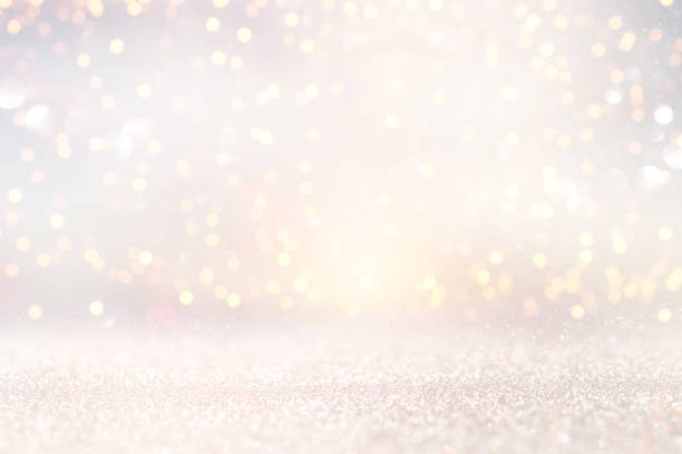 istock glitter vintage lights background. silver and light gold de-focused. 1070849792