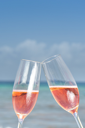 Rose wine in glasses at the beach