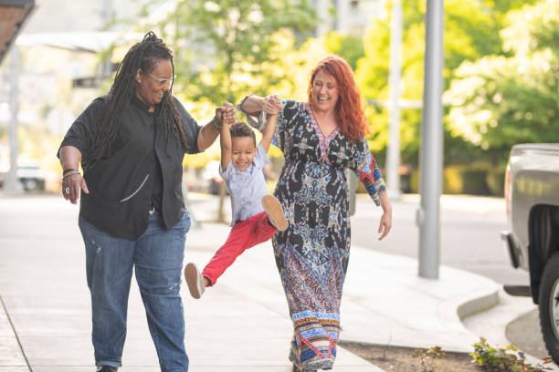 istock Female couple walking with their son 1070852458