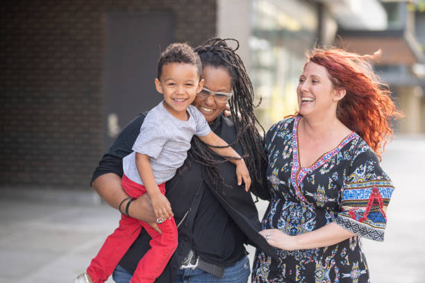 istock Female couple walking with their son 1070852672