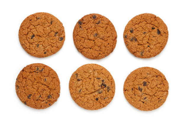 istock Oatmeal cookies with chocolate chips isolated on white background. Flat lay, top view 1070855200