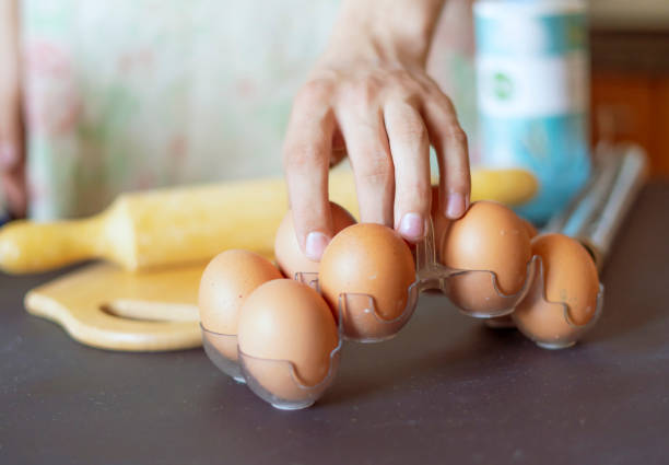 istock close up cook hands taking an egg while cooking f 1070855234