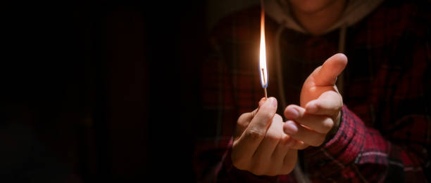 huge massive fire and burning match in hands in the dark f