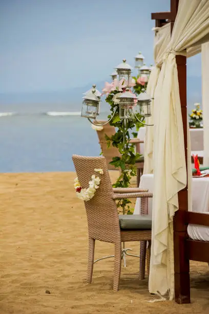 wedding decoration on the beach.Tropical settings for a wedding.wedding arch and flower decoration, venue, setup on tropical beach, outdoor beach wedding