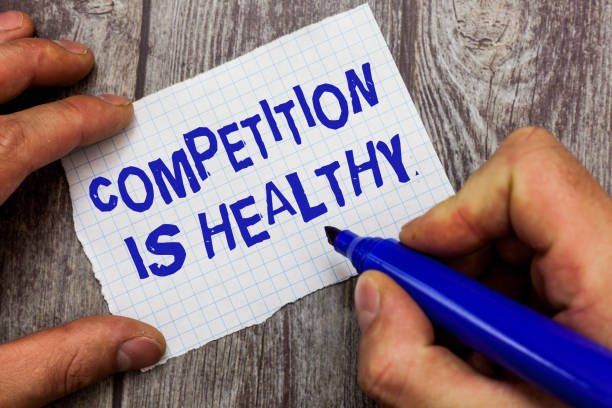istock Handwriting text writing Competition Is Healthy. Concept meaning Rivalry is good in any Venture leads to Improvement 1070855706
