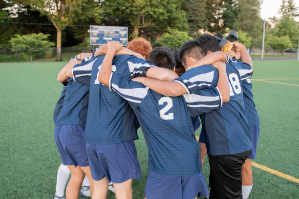 istock Soccer team huddling before a game 1070856368