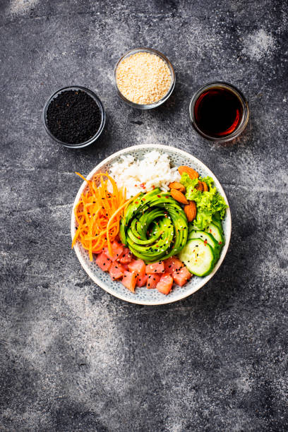 istock Hawaiian poke bowl with salmon, rice and vegetable 1070856564