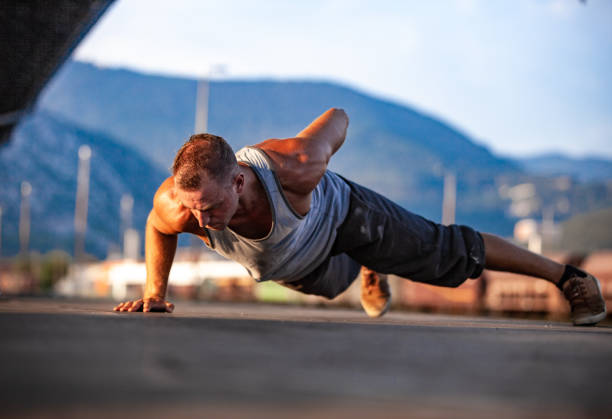 istock Young Adult Man Doing Push-ups With One Hand 1070866890