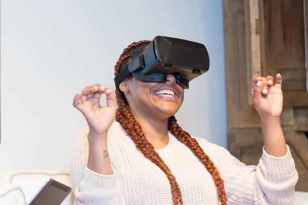 istock Happy young woman enjoying virtual reality glasses 1070869400
