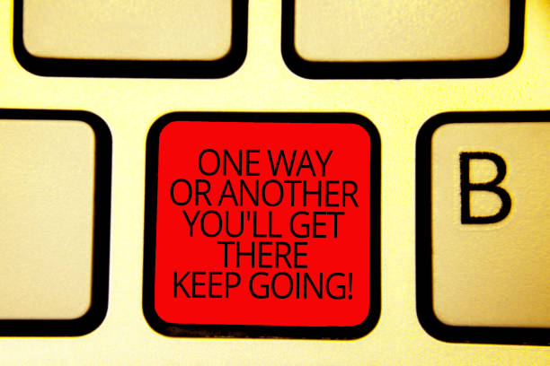 istock Text sign showing One Way Or Another You'Ll Get There Keep Going. Conceptual photo Keep trying to succeed Keyboard red key Intention create computer computing reflection document. 1070872192