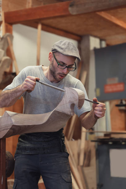istock Carpenter working on wooden forcola for venetian gondola 1070872438