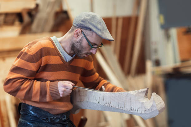 istock Carpenter working on wooden forcola for venetian gondola 1070872446