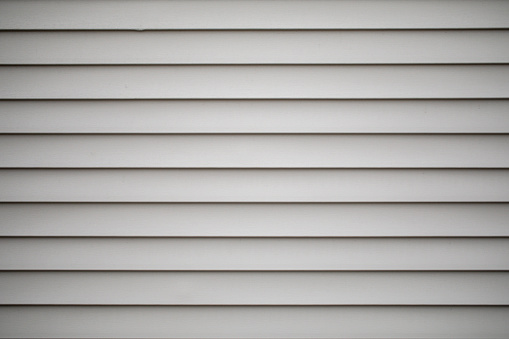 Grey or tan vinyl siding on a building