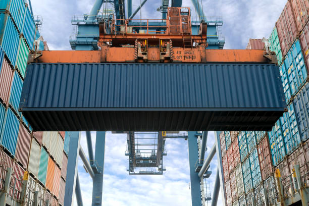 istock Industrial crane loading Containers in a Cargo freight ship. Container ship in import and export business logistic company. Industry and Transportation concept. 1070874394