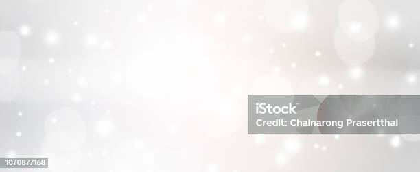 Abstract Blurred Of Silver Color With Bokeh And Glitter Snow Fall Background For Design Concept Stock Photo - Download Image Now