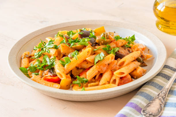istock Pasta caponata on a plate close up 1070881304